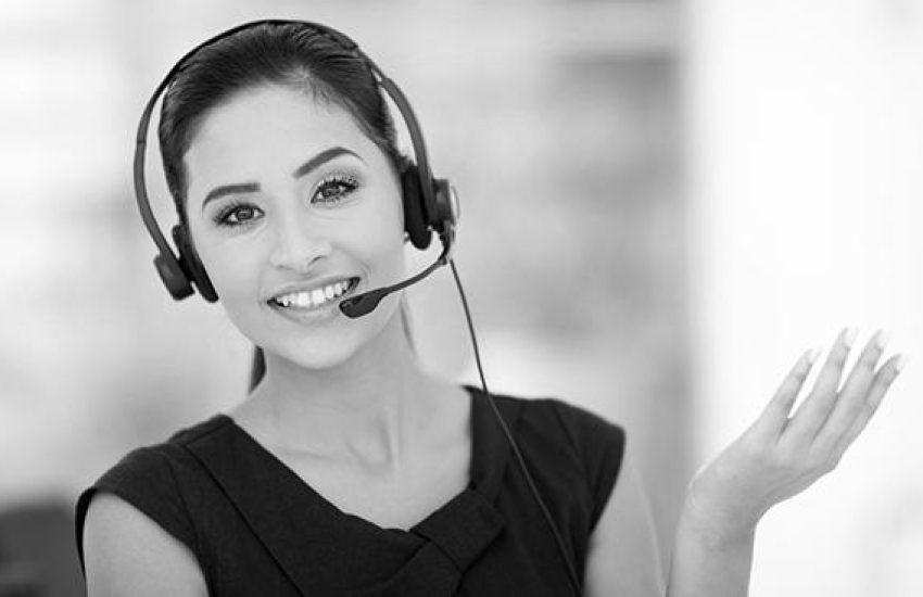 Closeup of a beautiful business customer service woman smiling